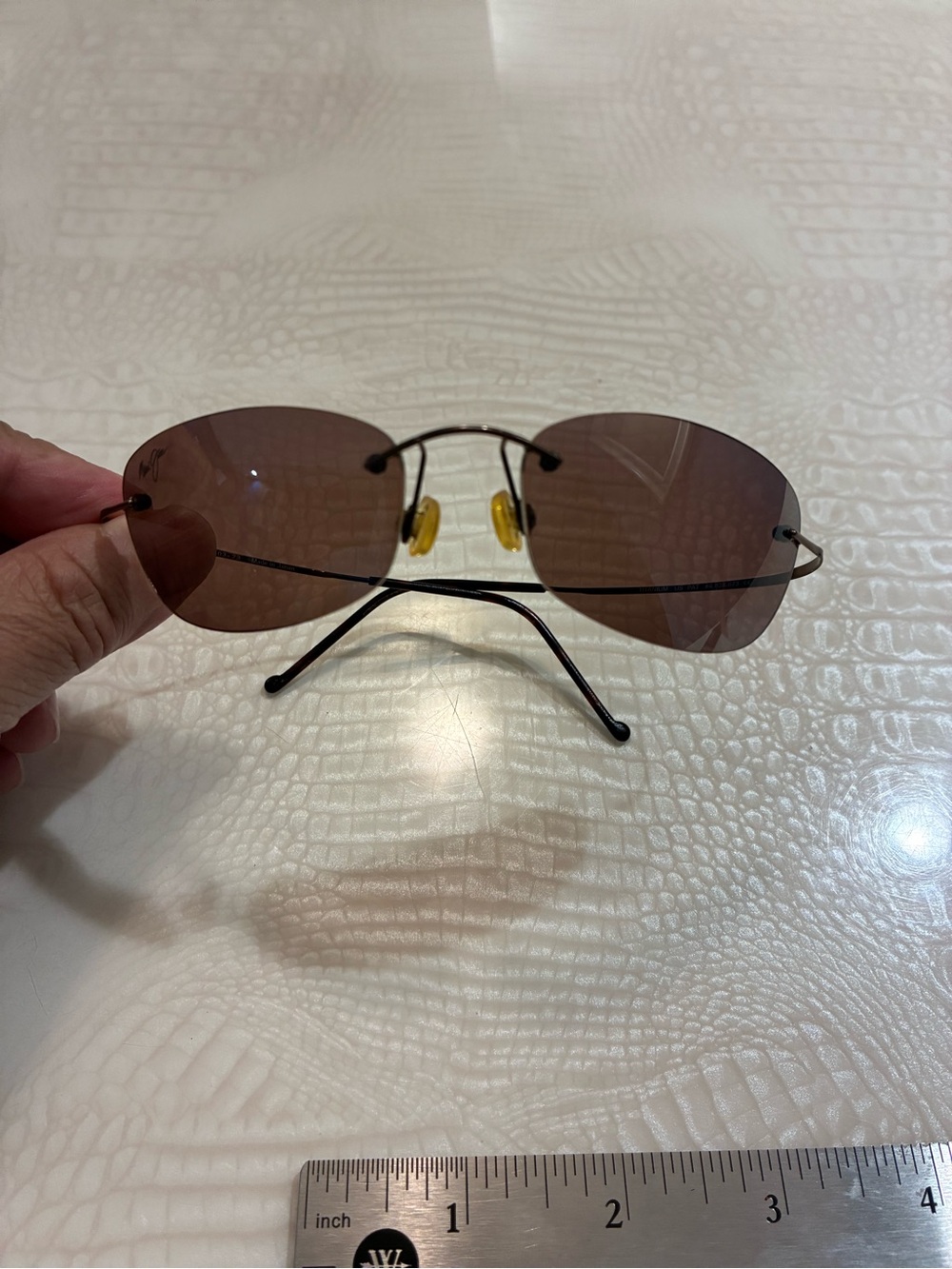 Maui Jim Rimless Sunglasses with Brown Lenses and Yellow Nose Pads